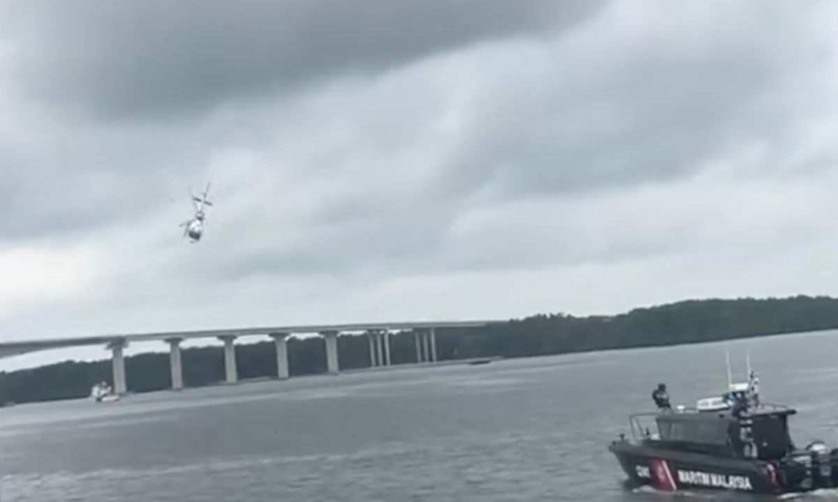Malaysian police helicopter crashes into river during emergency landing