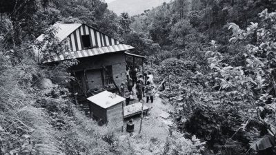 a group of people outside a house